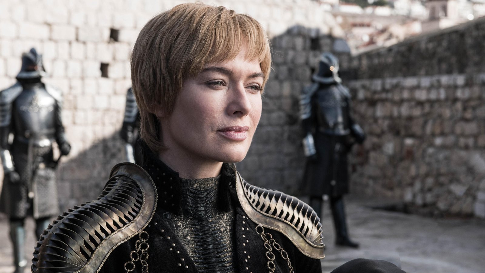 Queen Cersei (Lena Headey) smiling that smile of hers on Game of Thrones. Shoulder pads courtesy Julia Sugarbaker.